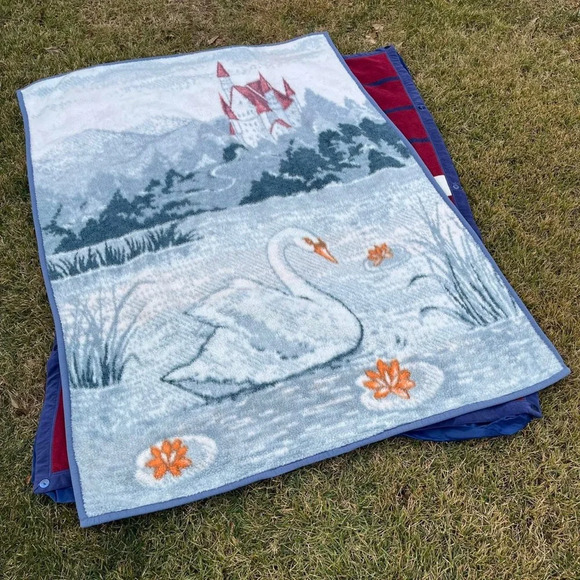 Swan swimming by in lake fleece blanket hidden castle house mountains